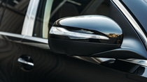 Close up shot of black modern car's side mirror Close up shot of black modern car's side mirror