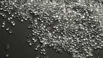 Transparent TPU granulate on black background
