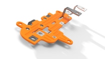 Orange molded industrial component with embedded metal contacts, shown as a technical product rendering.