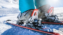 Winter skis and detailed view of the ski bindings concept in sunny day.  Winter skis and detailed view of the ski bindings concept in sunny day.