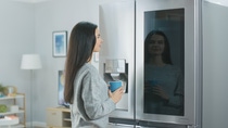 A modern refrigerator equipped with advanced cooling and insulation technology in a residential environment.