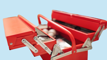 A red, open toolbox on a light blue background