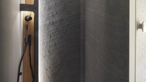 The slate walls in the wellness area of the VisionVenture are a world first. Up until now, it has not been possible to work with natural stone in the vehicle interior due to weight considerations. This is changing with the advent of VeneoSlate®, which is manufactured using the compact, non-foamed polyurethane Elastocoat®, as the material has a thin and incredibly lightweight layer of slate on its surface. Thanks to its low mounted height of only 1 millimeter, it can be installed in a highly spacesaving manner.  The material also combines the silky and natural appearance of the natural stone with the light weight and flexibility of polyurethane. This gives a huge degree of design freedom. Convex and concave shapes can be produced without any problems and the material’s water resistance makes it ideal for use in bathrooms and wet rooms.  Photo: Hymer GmbH & Co. KG