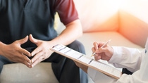 Urologist Doctor giving consult for prostate problems to patient. Urologic oncologists specialize in treating cancer of the urinary tract and male reproductive organs. Mens health problem concept. Urologist Doctor giving consult for prostate problems to patient. Urologic oncologists specialize in treating cancer of the urinary tract and male reproductive organs. Mens health problem concept.