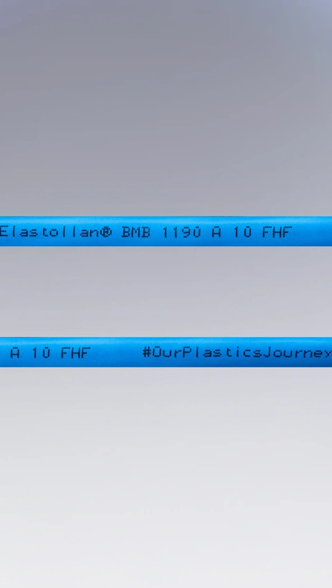 Blue multi-core cable with printed text “Elastollan® BMB 1190 A 10 FHF” and “#OurPlasticsJourney”.