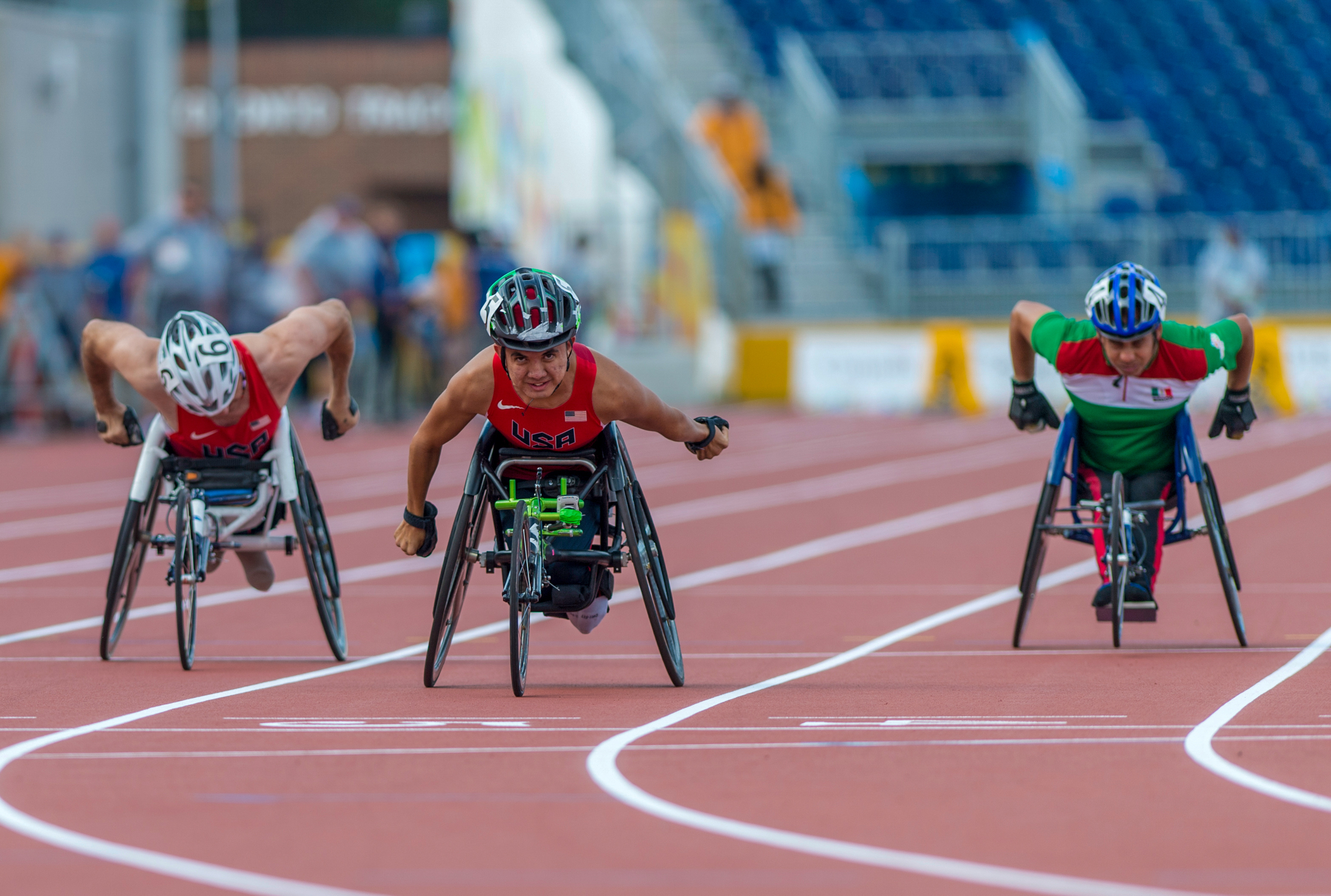 Raymond Martin from the USA (center) wins the Gold medal in the Men's 100m T52 Final with 17.01 during the 2015 Toronto Parapan Am Games