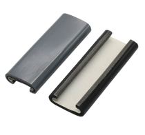 Two black plastic edge trim profiles, one shown assembled and one with its inner layer exposed.