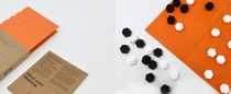 Packaging concept for the Xiangqi game set, featuring a foldable game board, game pieces, and sustainable packaging materials.
